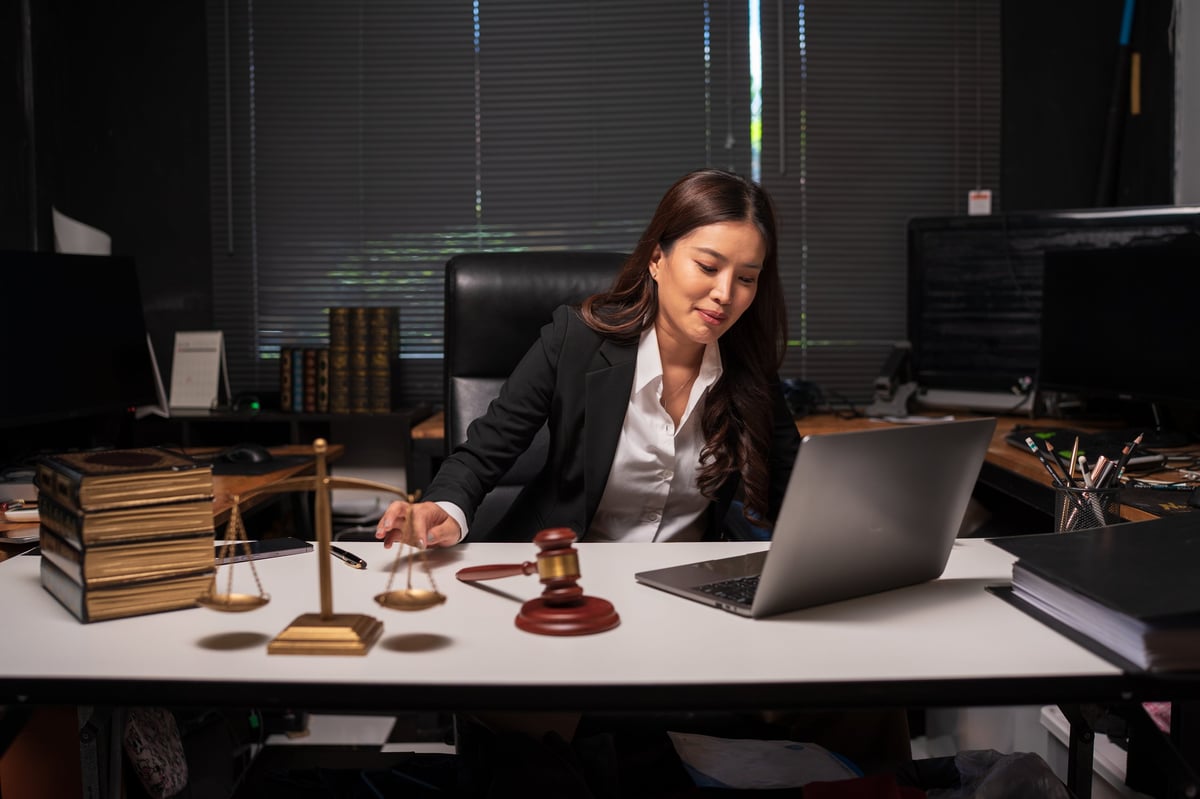 Female lawyer working on legal documents in an office
